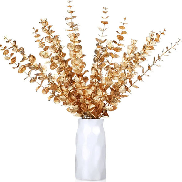 White vase with gold leaf branches on a white background