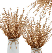 Two white vases with gold leaf branches on a white background