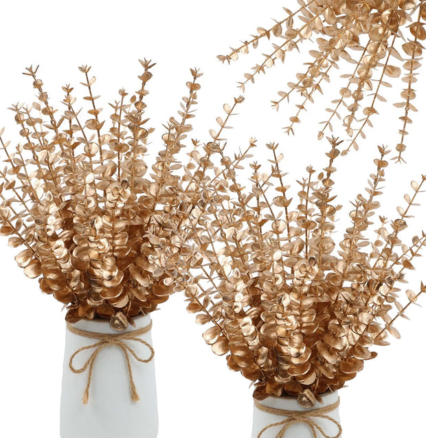 Two white vases with gold leaf branches on a white background