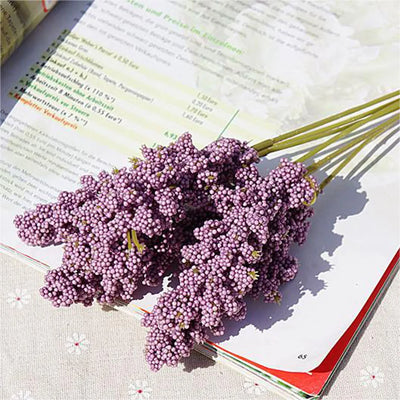 Bouquet of purple flowers on an open book