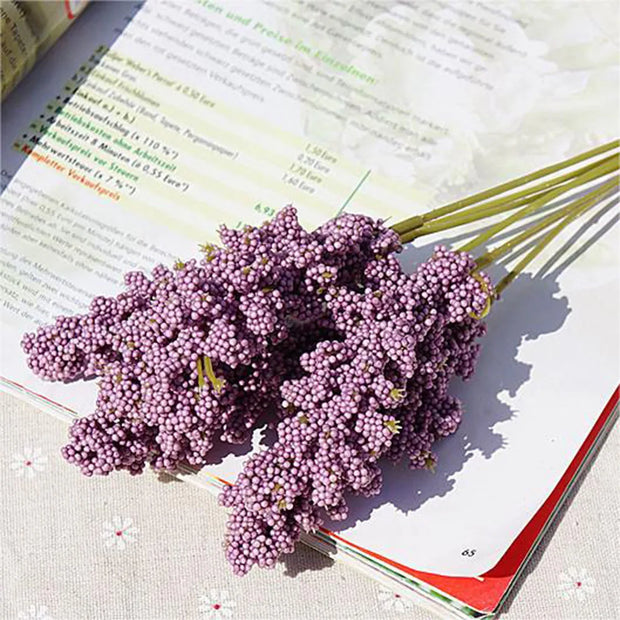 Bouquet of purple flowers on an open book
