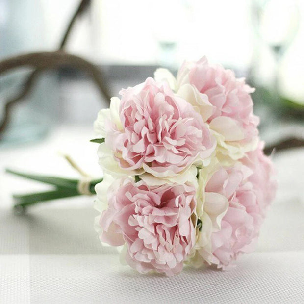 Bouquet of pink and white flowers on a light background