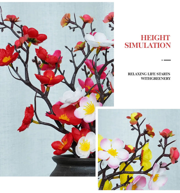 Artificial flower arrangement with red, pink, and white flowers on a light blue background.