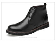 Black leather boot on a white background
