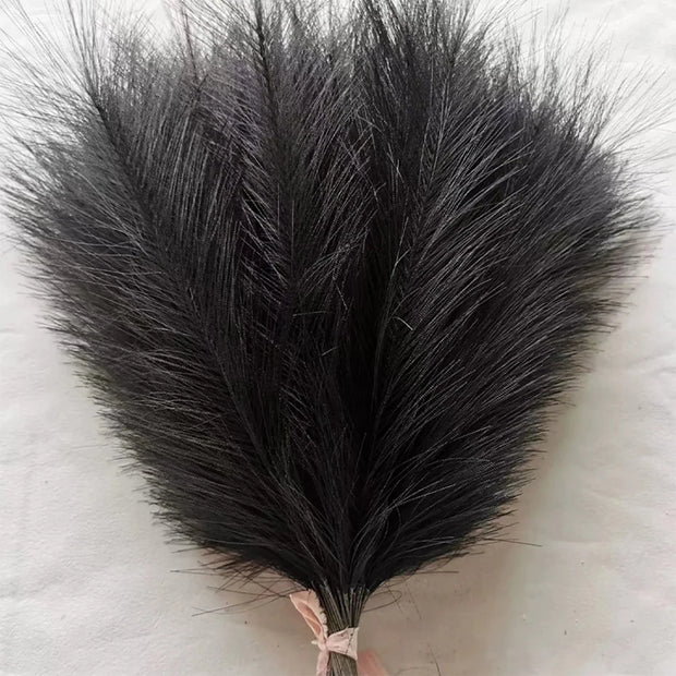 Black ostrich feather fan on a light background
