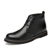 Black leather boot on a white background