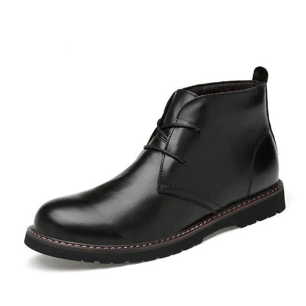 Black leather boot on a white background