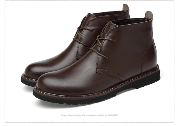 Pair of brown leather boots on a white background