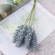 Bouquet of small flowers on an open book with a light background