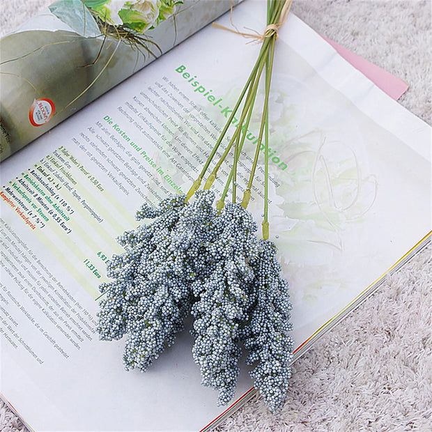 Bouquet of small flowers on an open book with a light background