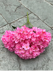 Bouquet of pink flowers on a stone surface