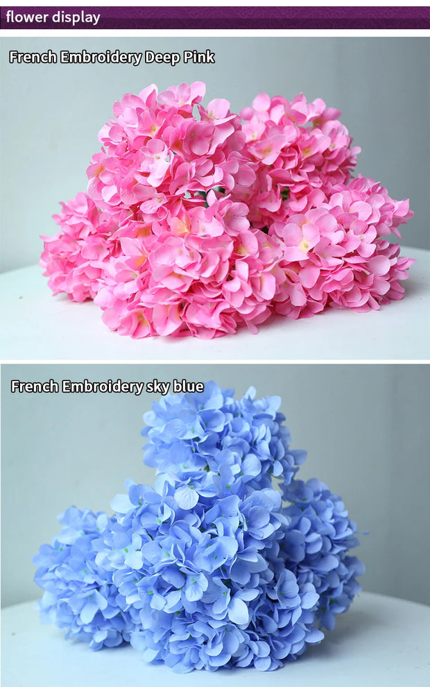 Two bouquets of flowers, one pink and one blue, on a white surface with a gray background.