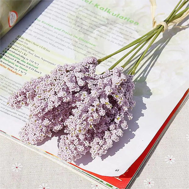 Bouquet of purple flowers on an open book
