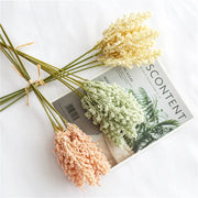 Bouquet of dried flowers on a magazine with a white background