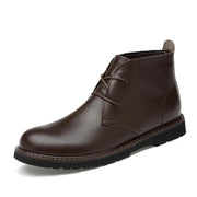 Brown leather chukka boot on a white background