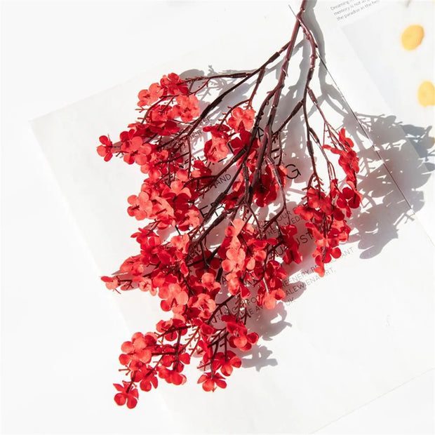 Red floral branch on a white background