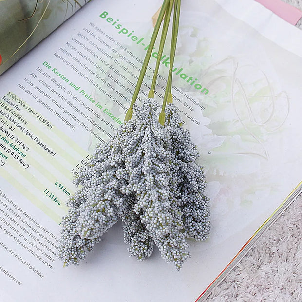 Bouquet of dried flowers on an open book