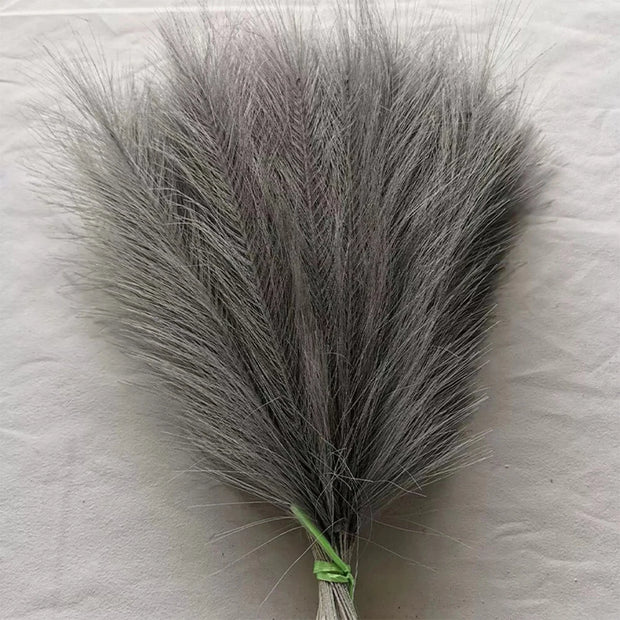 Gray feathered object on a textured white background