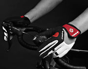 Person wearing cycling gloves on a bike handlebar with a black and white color scheme.
