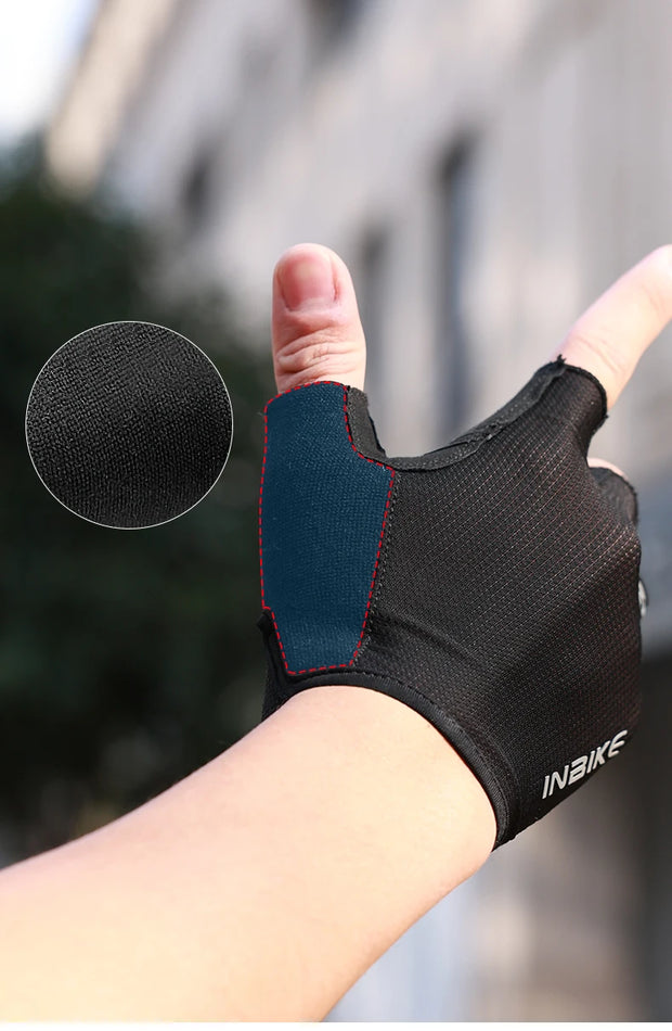 Black half-finger glove on a blurred outdoor background