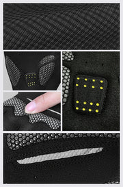 Close-up of black textured material with embedded yellow lights and a finger for scale.