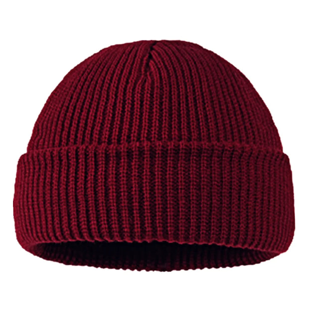 Maroon knit beanie on a white background