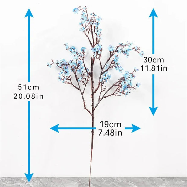 Measurement chart of a decorative branch with blue flowers on a white background
