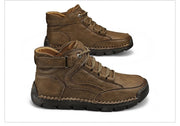 Pair of brown leather boots on a white background