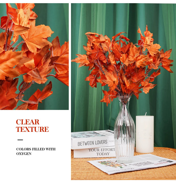 Orange artificial leaves in a clear vase with a green curtain background