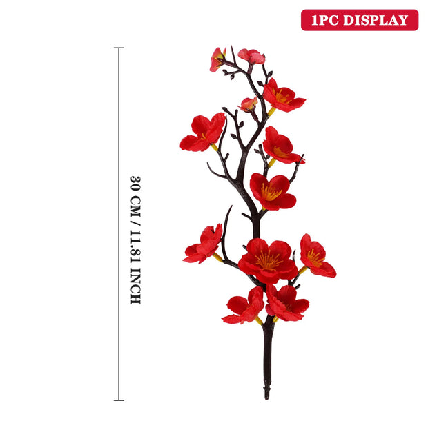Artificial red flower branch with measurements on a white background
