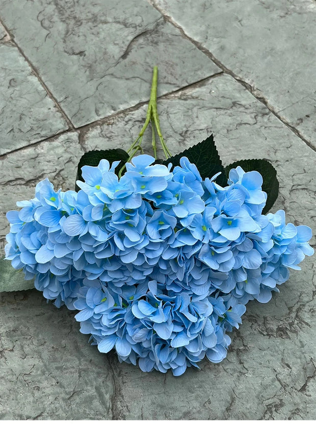 Blue flowers on a stone surface
