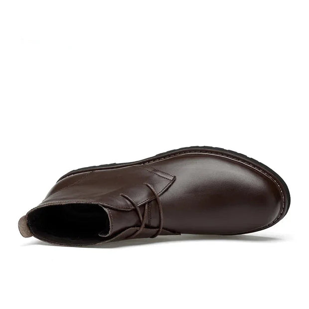 Brown leather boot on a white background