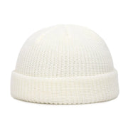 White knit beanie on a white background