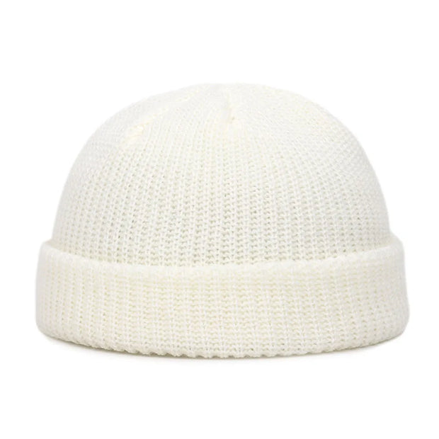 White knit beanie on a white background