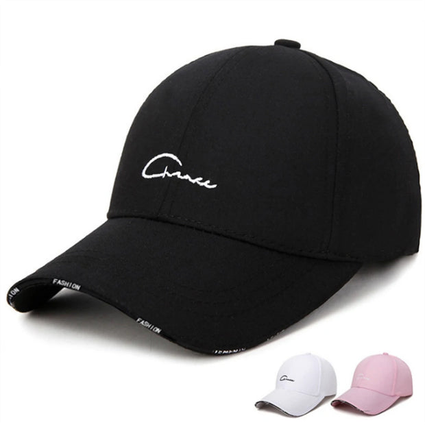 Black cap with white text on a white background, with additional caps in white and pink below.