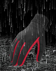 Black glove with red accents on a dark, rain-drenched background