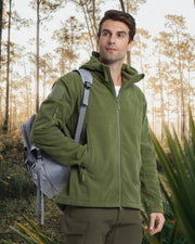 Man wearing a green jacket with a backpack in a forest setting