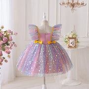 Colorful fairy dress on a mannequin against a white wall with decorative elements.