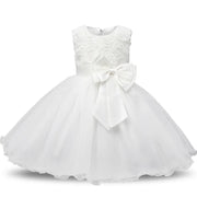 White lace dress with a large bow on a white background
