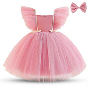 Pink tutu dress with bow on a white background