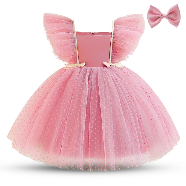 Pink tutu dress with bow on a white background