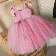 Pink dress with polka dots on a wooden chair