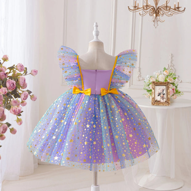 Colorful fairy dress with star pattern on a mannequin against a white background