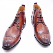 Brown leather dress shoes with laces on a white background