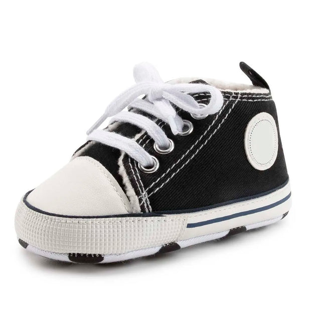 Black and white baby shoe on a white background
