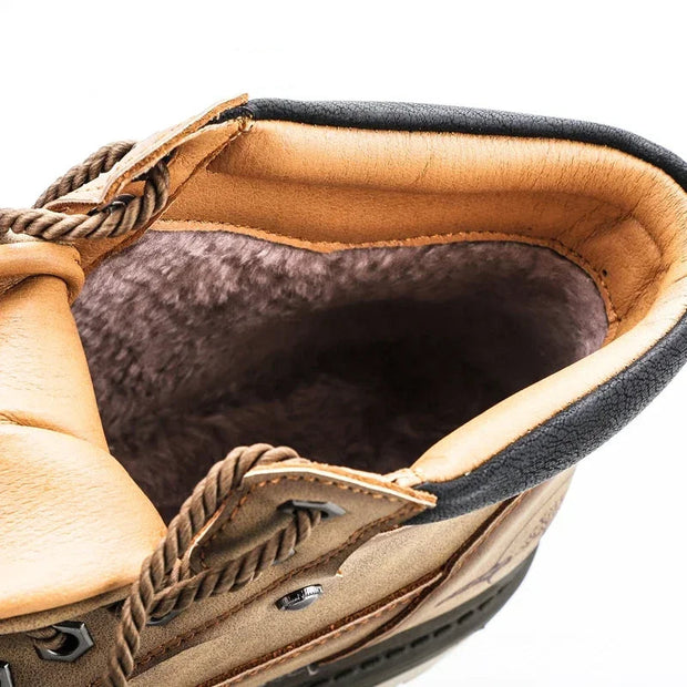 Close-up of a brown leather shoe with visible branding on a white background