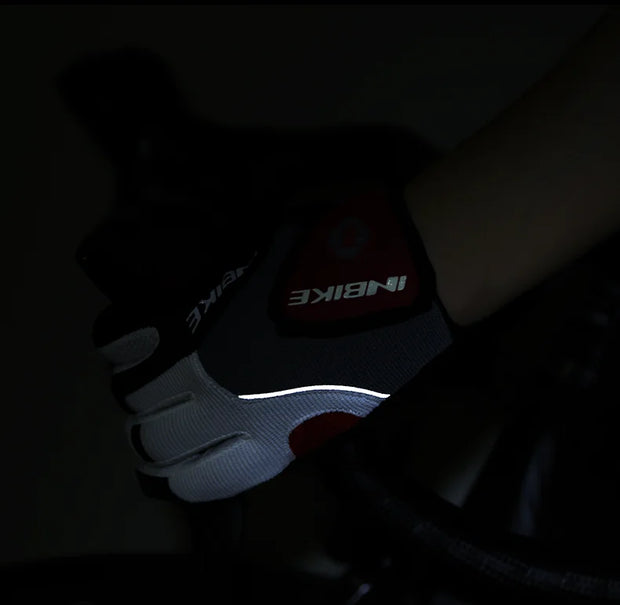 Close-up of a gloved hand holding a bike handlebar