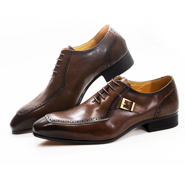 Brown leather dress shoes with a gold buckle on a white background