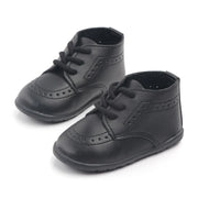 Pair of black dress shoes on a white background