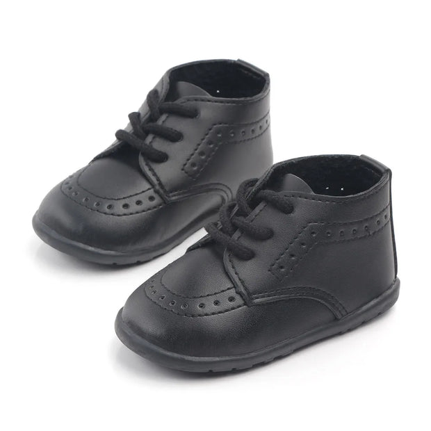 Pair of black dress shoes on a white background